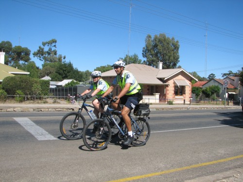 Police on bicycles ahead of the riders in the 2010 Tour Down Under Police on bicycles ahead of the riders in the 2010 Tour Down Under